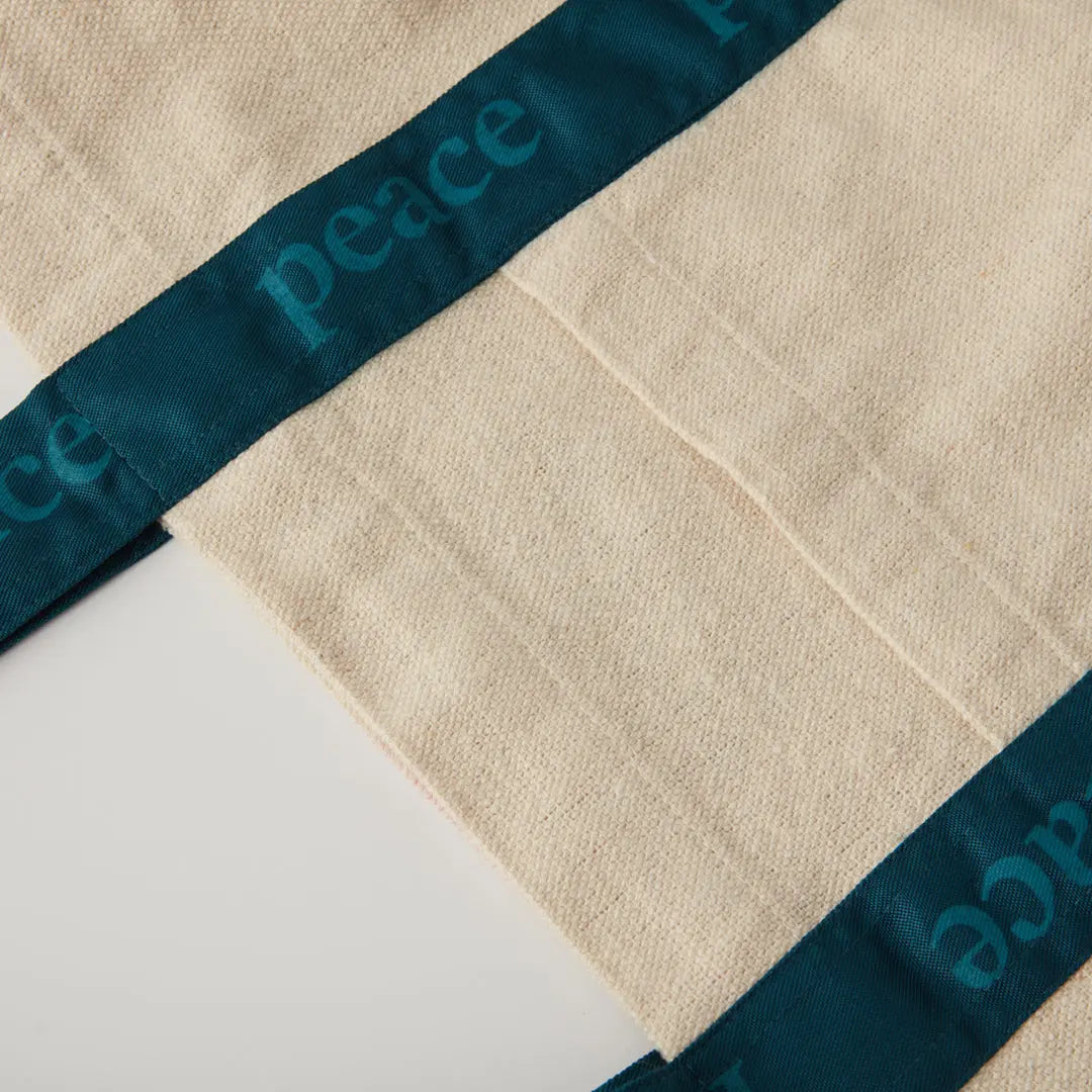 Peace shopper - printed teal strap detail